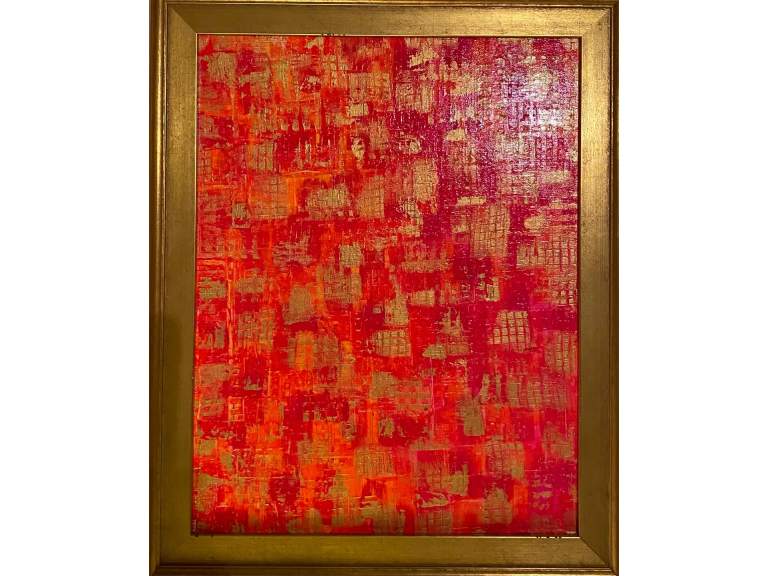 A painting of red and gold squares in a frame.