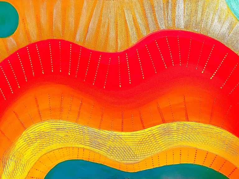 A close up of the colorful waves on the wall